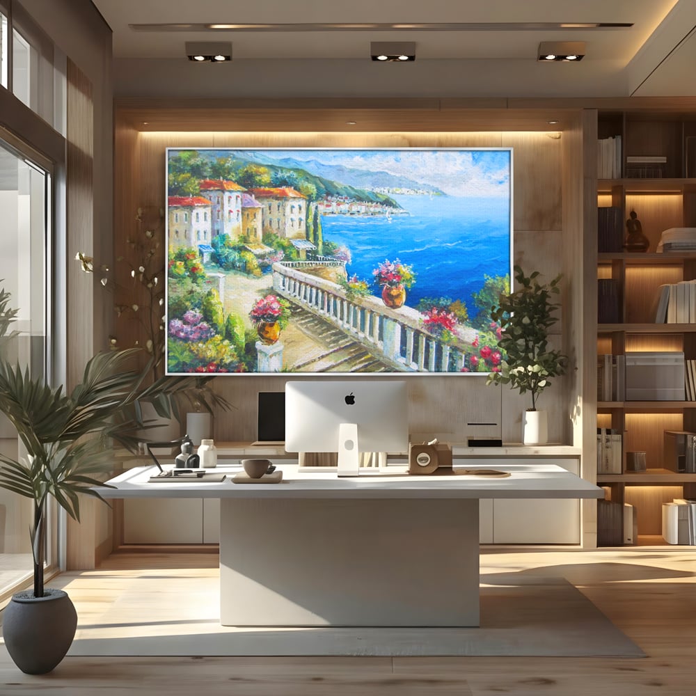 Tablou canvas cu pictura case pe malul marii, in rama de aluminiu argintiu, pe perete intr-un birou